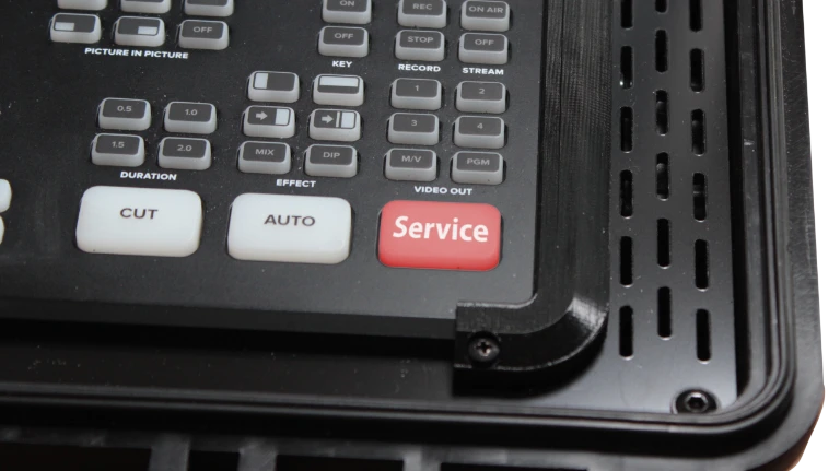 Affiche le bouton de service sur un boîtier BSS pour l’ATEM Mini en tant que symbole